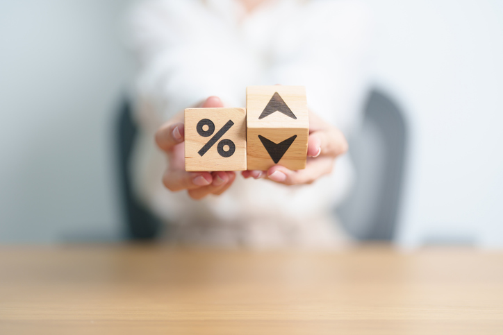 wood block of percentage change to UP and Down arrow. Interest rate, GDP, stocks market, financial, deflation and Inflation, ranking, mortgage, debt, Loan and Economic Recession concept iStock
